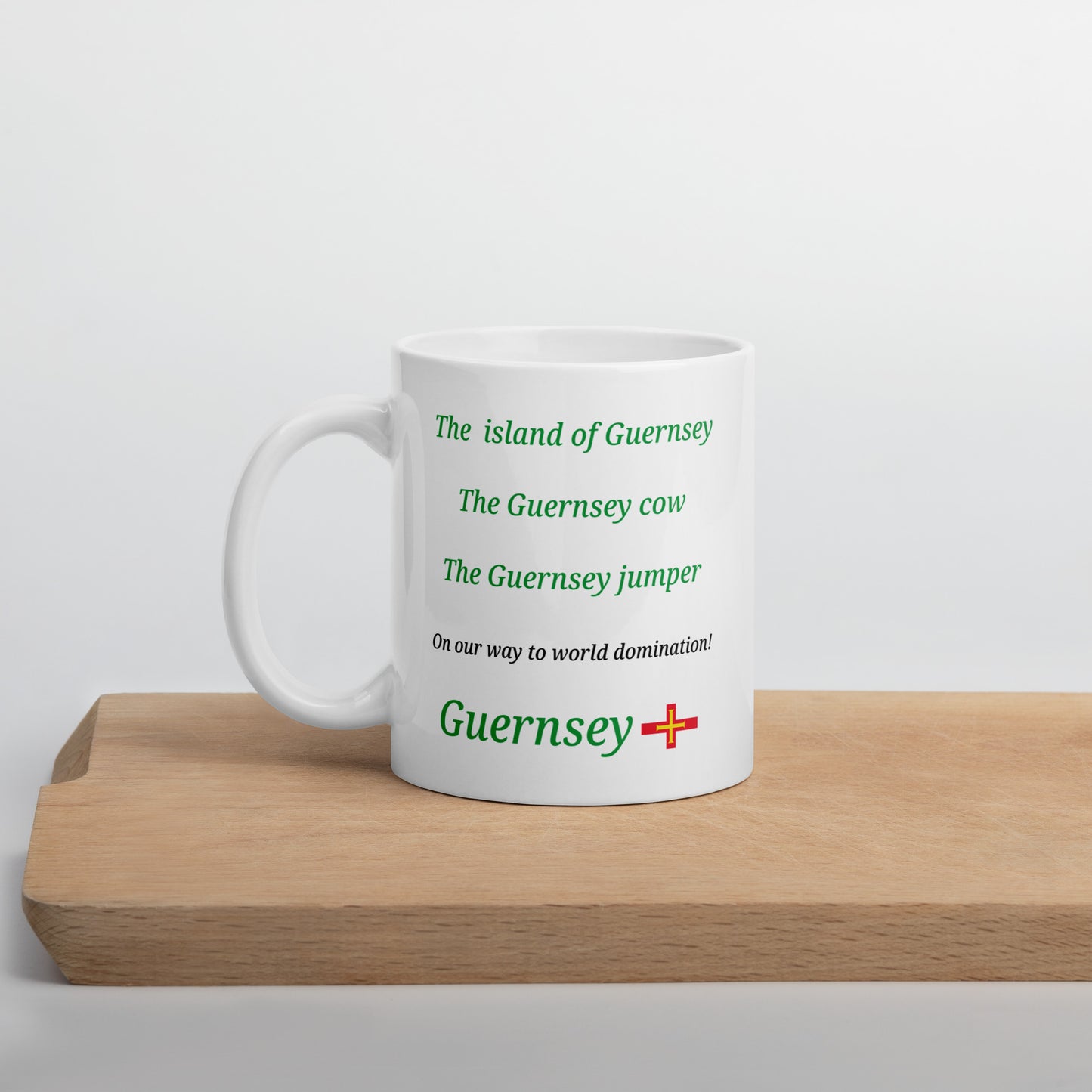 White glossy mug (The island of Guernsey, The Guernsey cow, The Guernsey jumper - on our way to World domination)