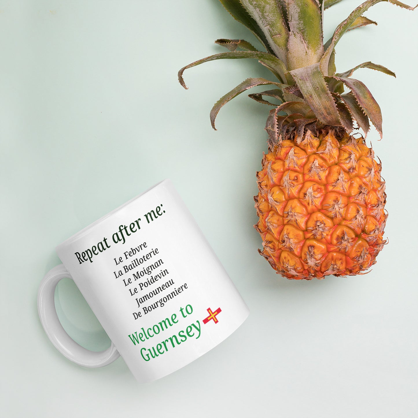 White glossy mug(Repeat after me:  Le Febvre, La Bailloterie, Le Moignan, Le Poidevin, Jamouneau, De Bourgonniere - welcome to Guernsey)