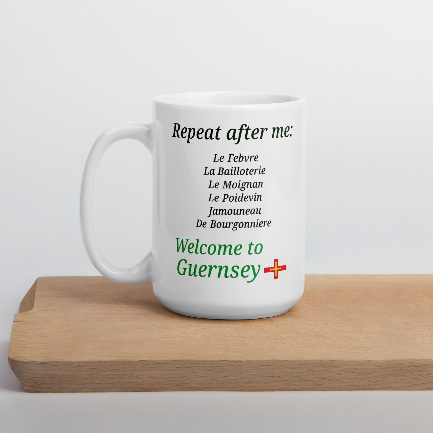 White glossy mug(Repeat after me:  Le Febvre, La Bailloterie, Le Moignan, Le Poidevin, Jamouneau, De Bourgonniere - welcome to Guernsey)