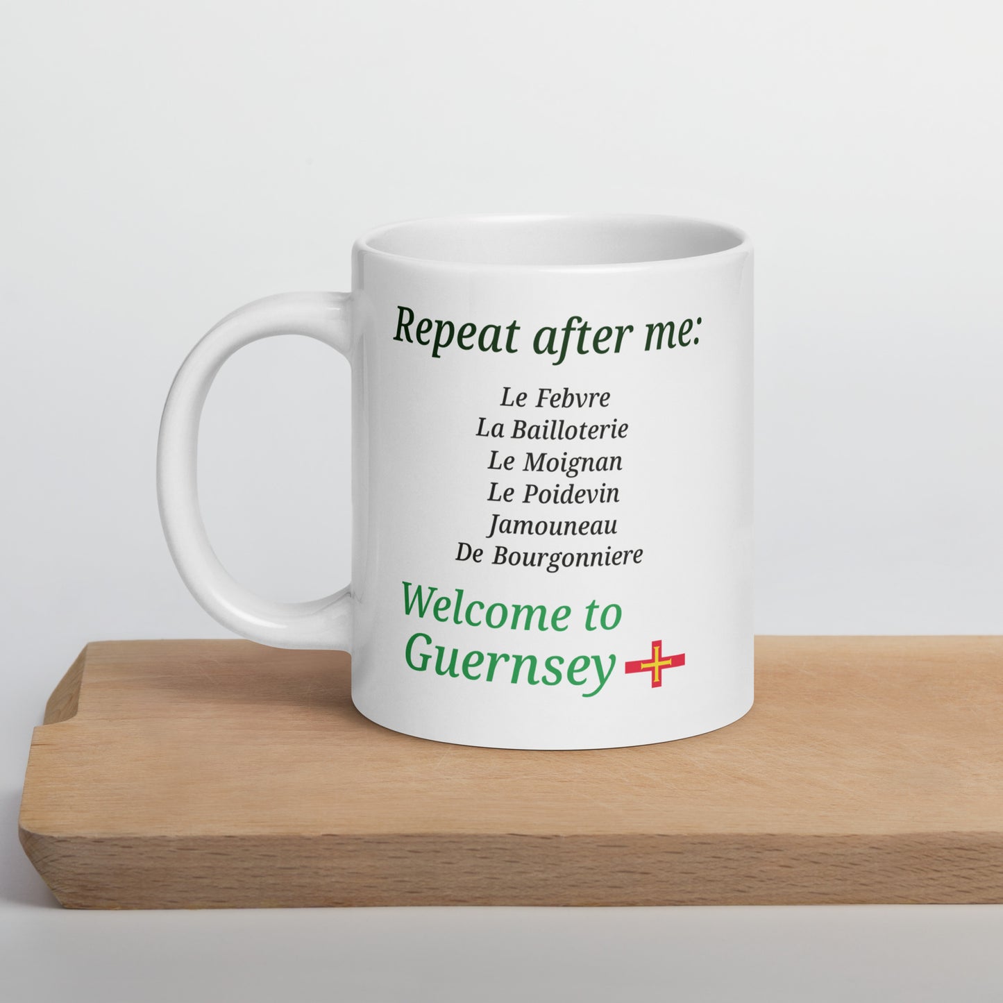 White glossy mug(Repeat after me:  Le Febvre, La Bailloterie, Le Moignan, Le Poidevin, Jamouneau, De Bourgonniere - welcome to Guernsey)